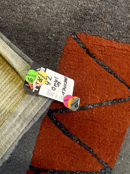  During the late 20th century Tisca France became known for bold abstract wool rugs